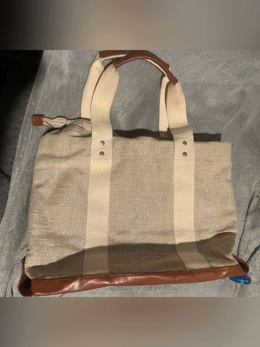 Neutral Canvas Tote Bag with silver. Tan handles frayed a little on edges.